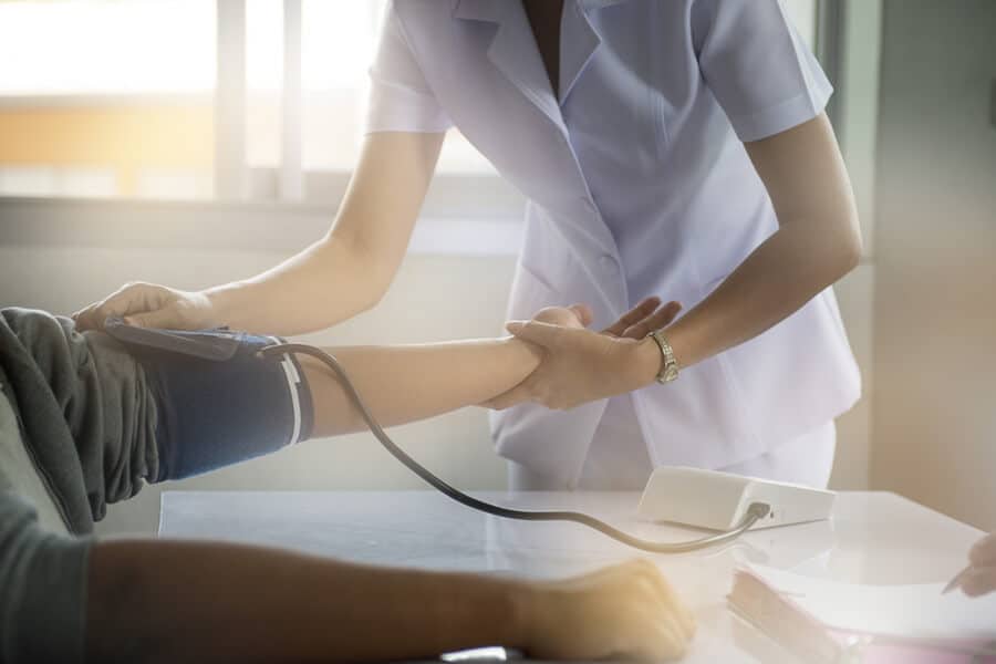 General nurse meassuring a blood pressure