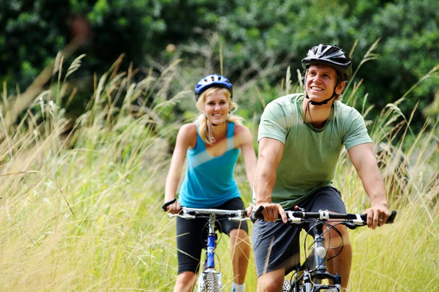 Happy couple riding bicycles